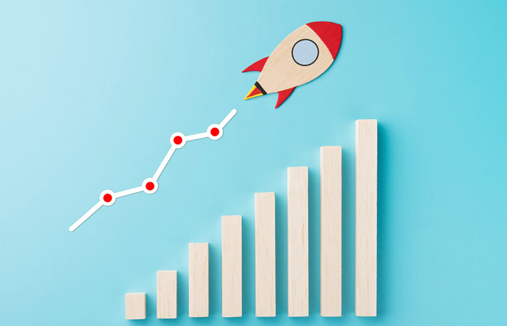 Rocket and chart on blue background business financial start up