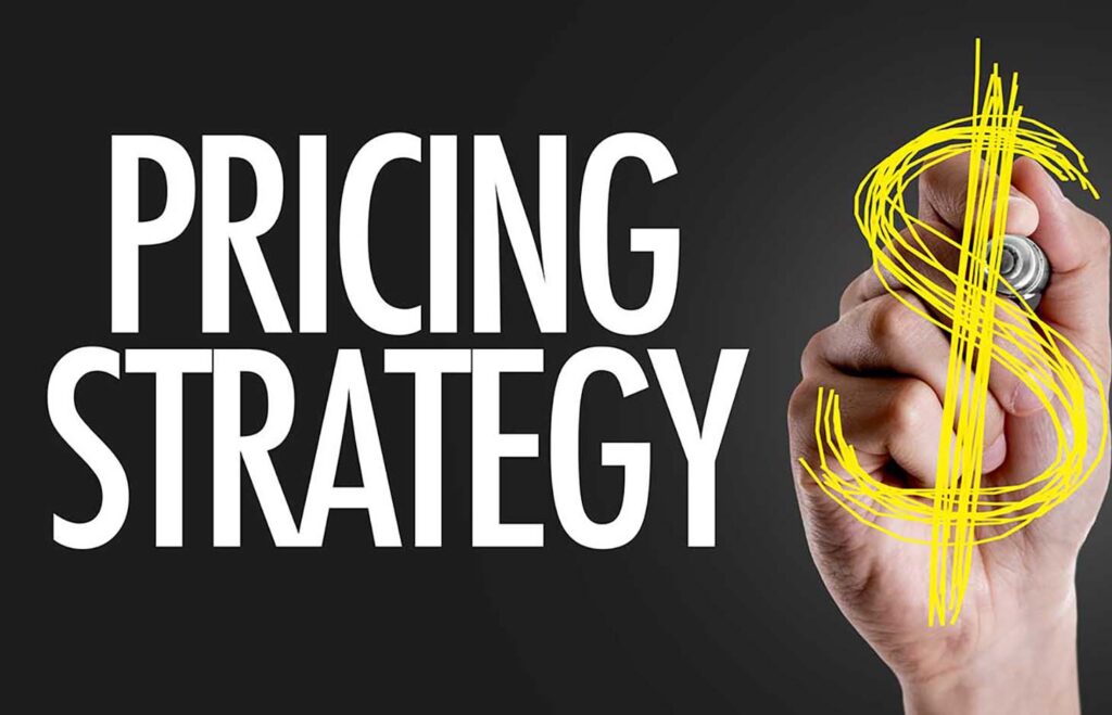 Hand writing the text: Pricing Strategy