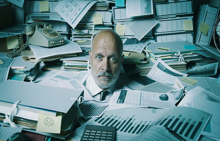 Stressed accountant overwhelmed by work