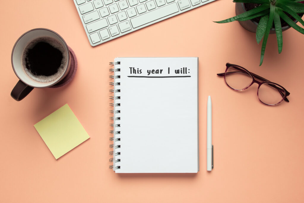 Stock photo of 2020 new year notebook with list of resolutions a